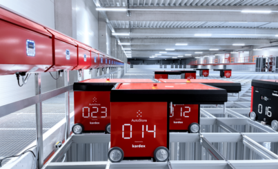 A red autostore cart on a metal grid